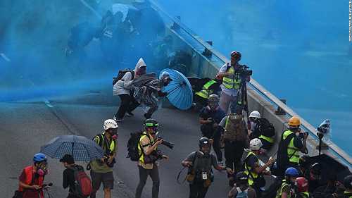 Man shot with live round in major escalation of Hong Kong protests